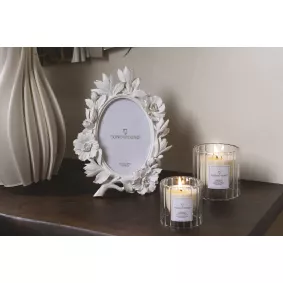 candele profumate in vasetto accese